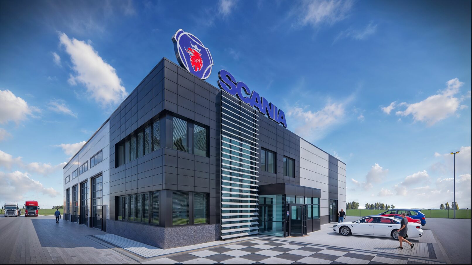 A modern Scania technical service facility with a sleek, dark-panel façade, large windows, and a prominent blue Scania logo atop the building. The entrance features a glass vestibule and vertical sunshade fins. The foreground includes a paved parking area with parked vehicles and people walking, while Scania trucks are visible near the service bays in the background, all under a bright, partly cloudy sky.