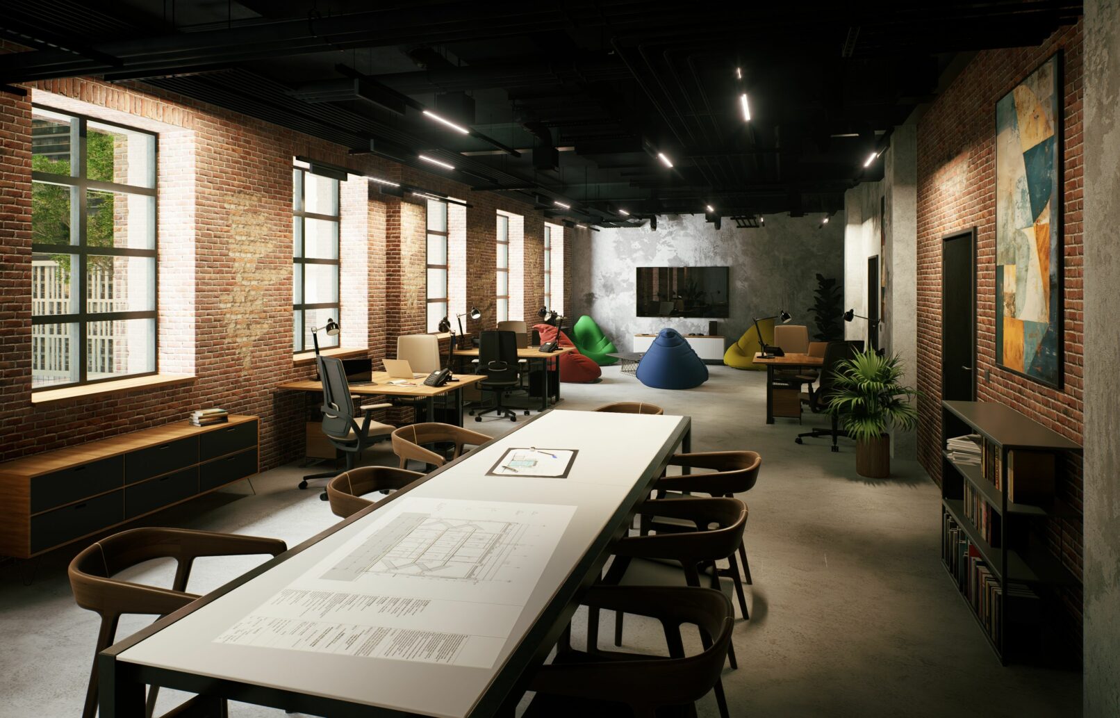 Photorealistic visualisation of a modern industrial office interior set in a reclaimed factory. The space features exposed red brick walls, raw concrete floors, steel-framed windows, and black-painted ceiling ducts. The layout includes shared worktables, individual workstations with task lamps, and a cozy lounge area with colorful beanbags and a low coffee table. Natural light filters through large windows, creating a dynamic atmosphere. The design combines industrial materials with warm wood furniture, greenery, and abstract artwork for a balanced and functional workspace.