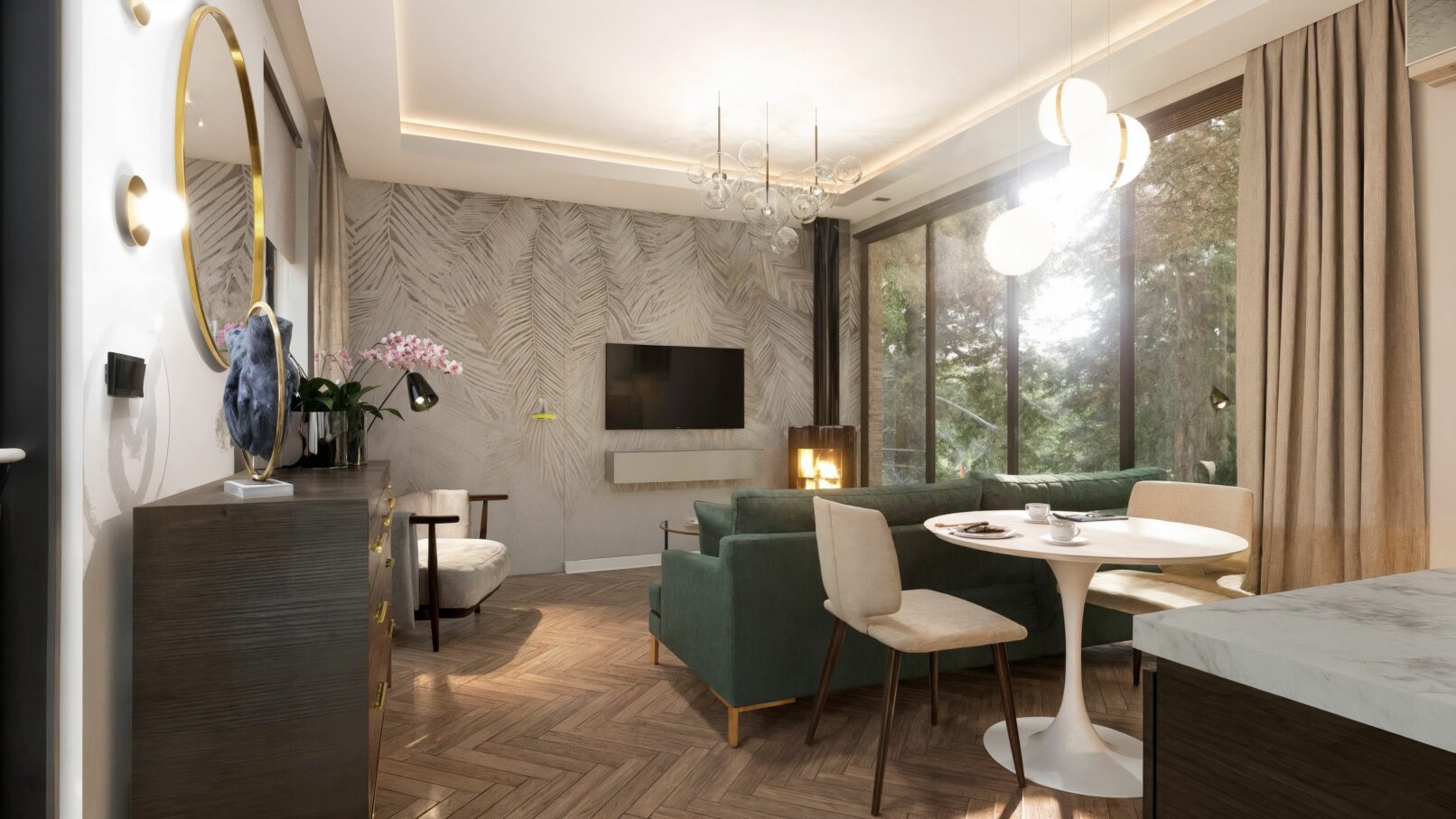 Open-concept living and dining area with a modern, elegant design. A green velvet sofa with a side table is in the foreground, facing a dark metal fireplace and large glass sliding doors that open to an outdoor view. A white round dining table with two light-colored chairs is in the midground, with a striking white wallpaper featuring a leaf pattern on the wall behind the television.