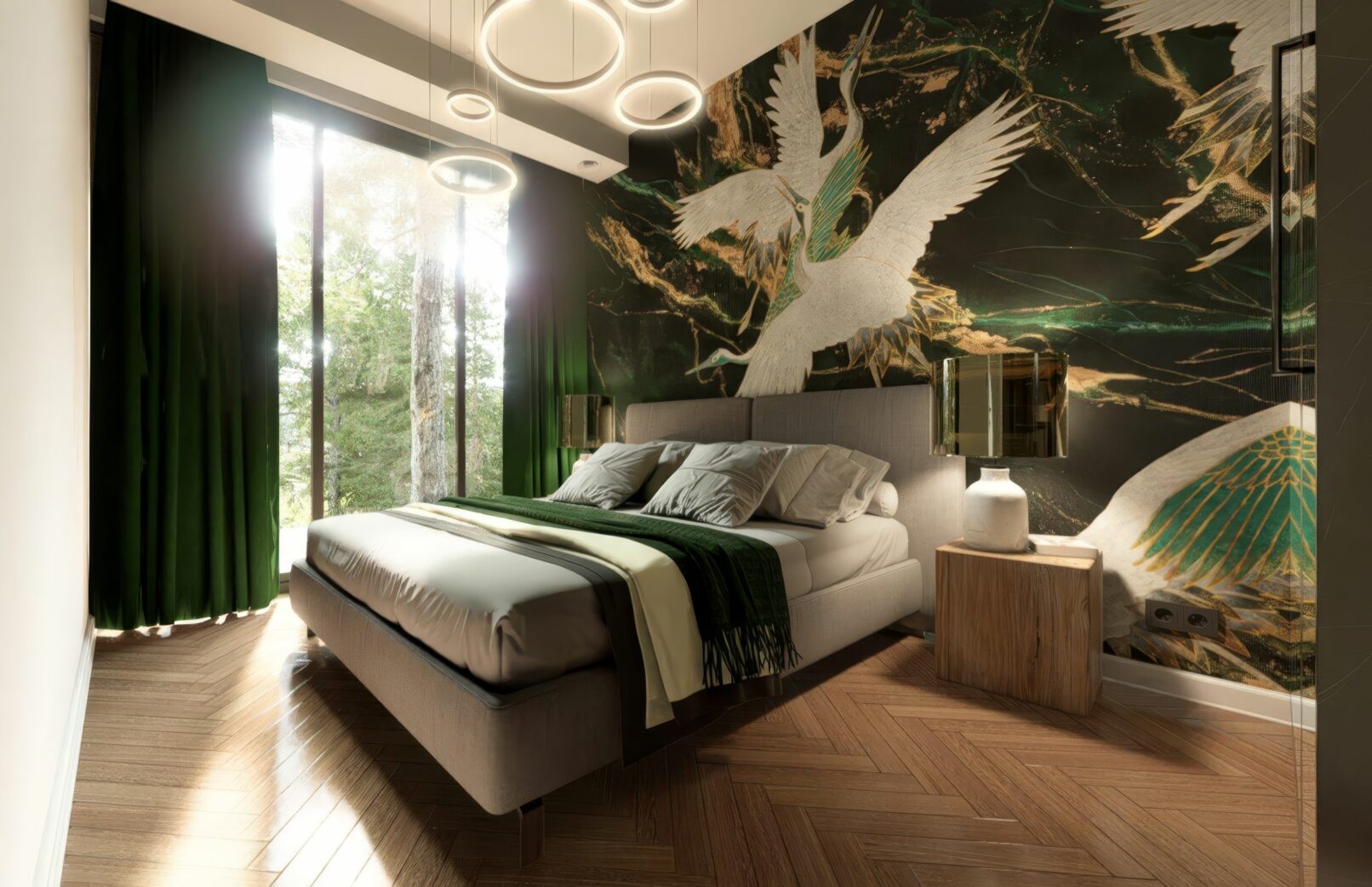 Bedroom with a large bed featuring a grey upholstered headboard and a dark green patterned accent wall with white crane imagery. The room has dark green curtains, large windows overlooking trees, wooden herringbone flooring, and modern circular pendant lights on the ceiling.