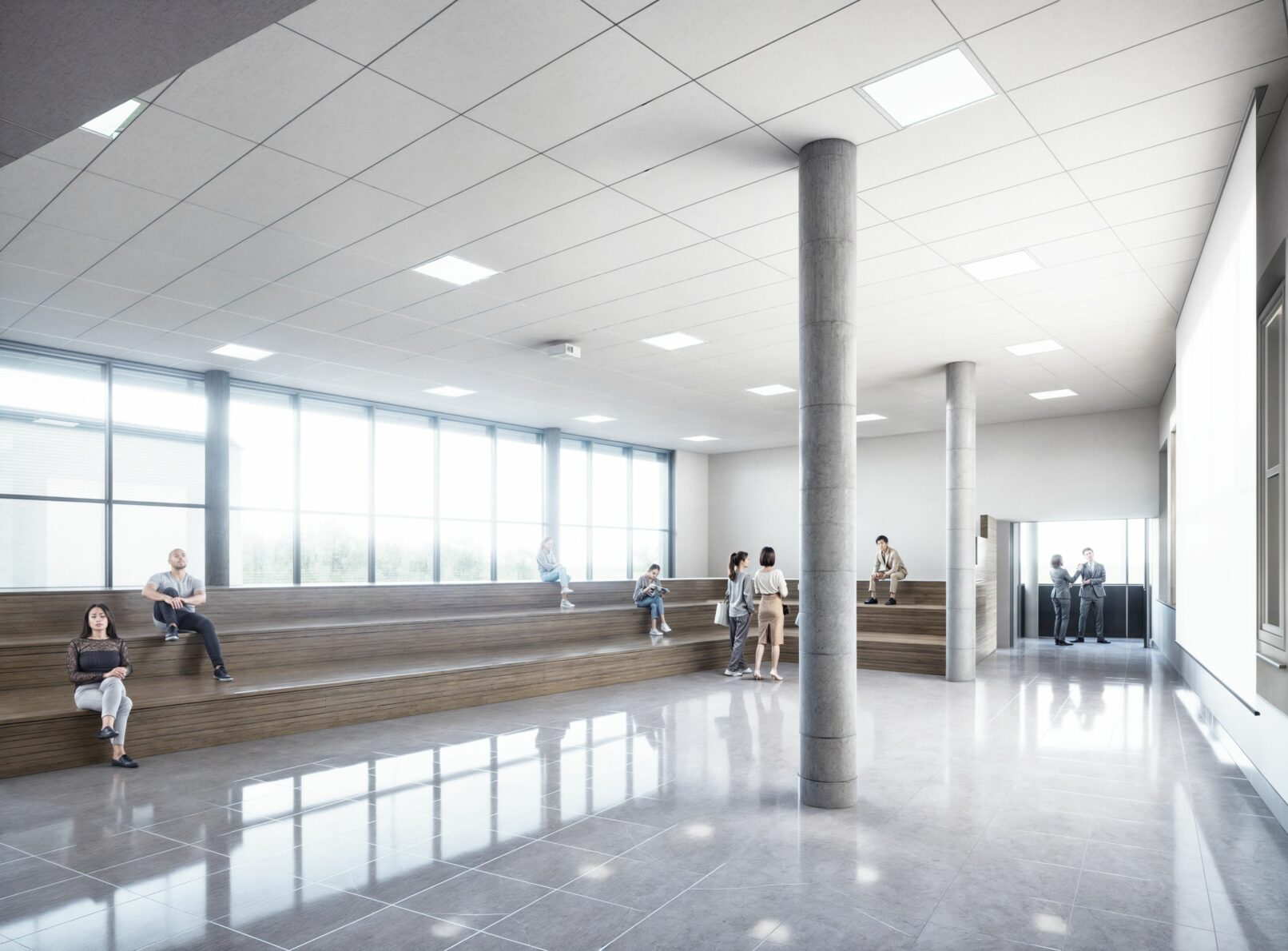 Spacious, light-filled academic atrium with tiered wooden seating, concrete columns, and polished tile flooring. Students are casually seated or standing in small groups, creating a relaxed atmosphere. Large windows flood the space with natural light, enhancing the modern, minimalist design.