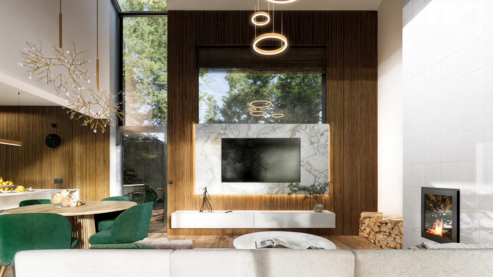 A contemporary open-plan living and dining area featuring double-height ceilings, a marble-accented TV wall, and warm wooden finishes throughout. The space includes a modern grey sectional sofa, emerald green dining chairs, elegant sculptural lighting fixtures, and expansive windows that bring in natural light and forest views. The minimalist kitchen blends marble surfaces with wood textures, creating a refined and inviting interior.