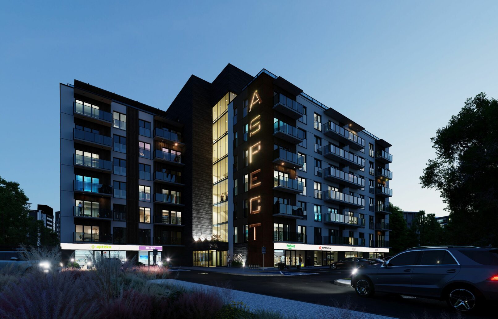 Evening render of the building with warm interior lighting and the illuminated "ASPECT" signage on the corten steel façade.