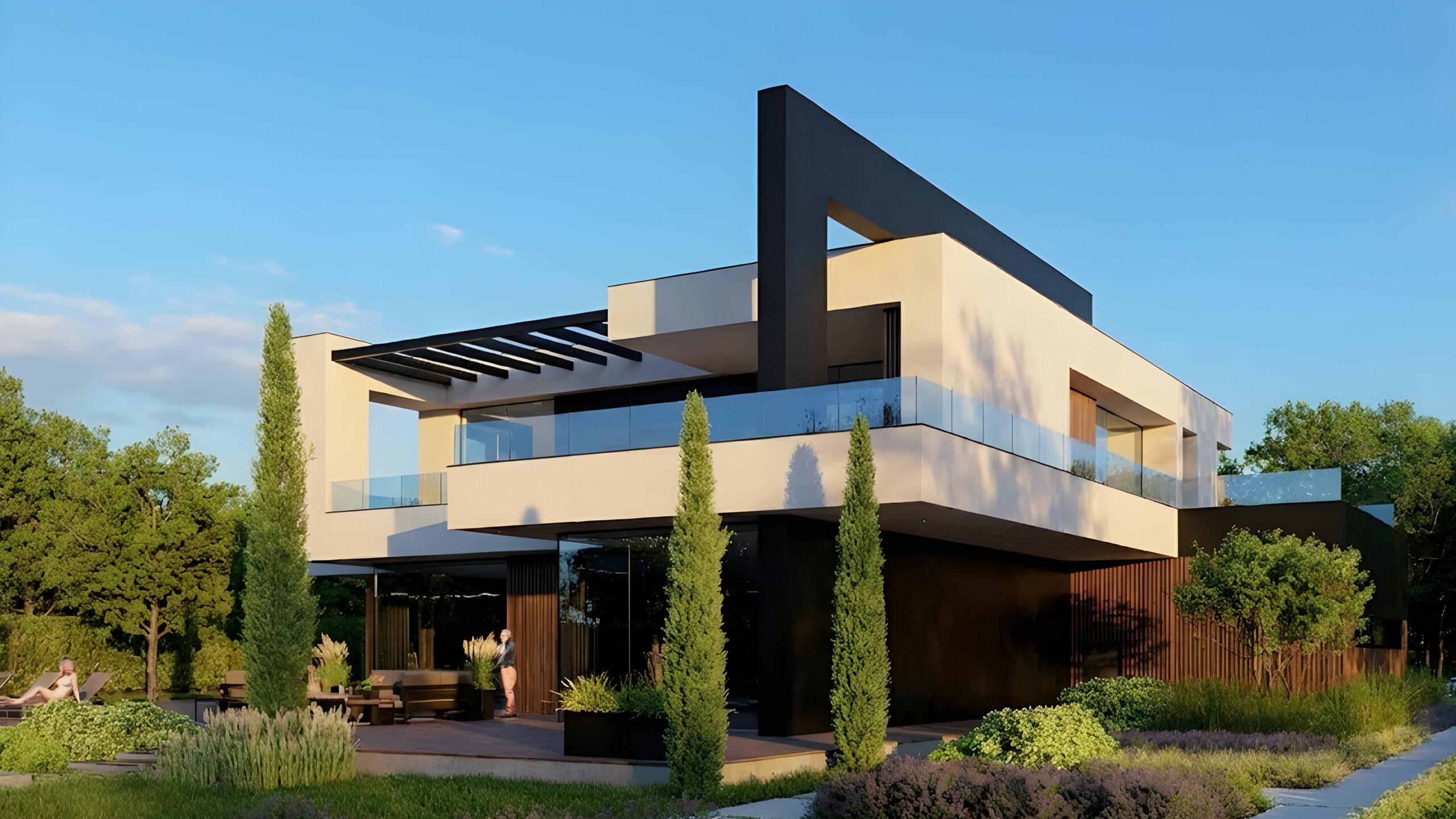 Angled backyard view of a modern residence with expansive windows, black cladding, and natural wood elements. The house is surrounded by lush landscaping and clear blue sky
